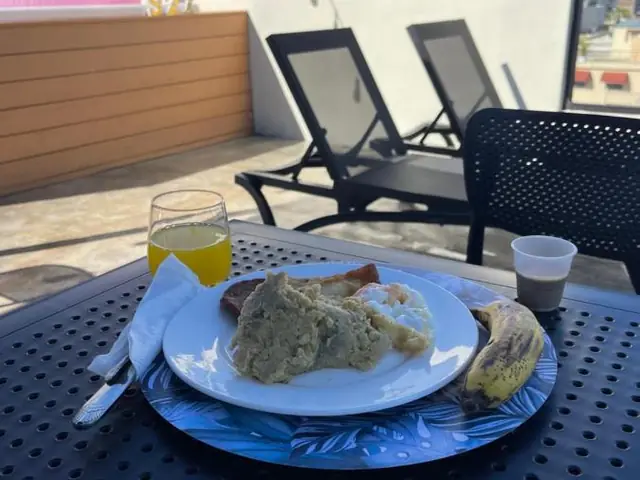 A breakfast served on the rooftop terrace at Studio 27